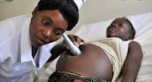 A courtesy photo of a pregnant teenager receiving antenatal services 